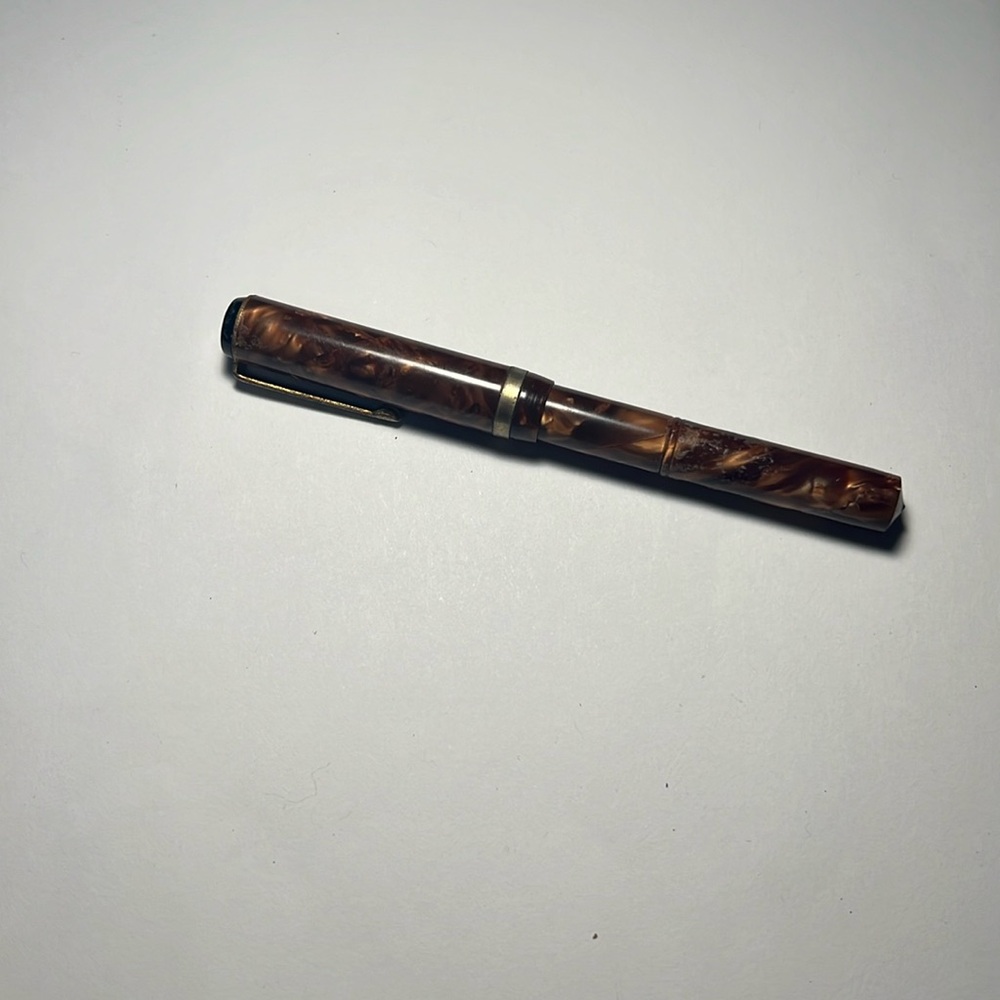 Vintage Waltham ink pen in marbled brown.    14k gold plated nib.